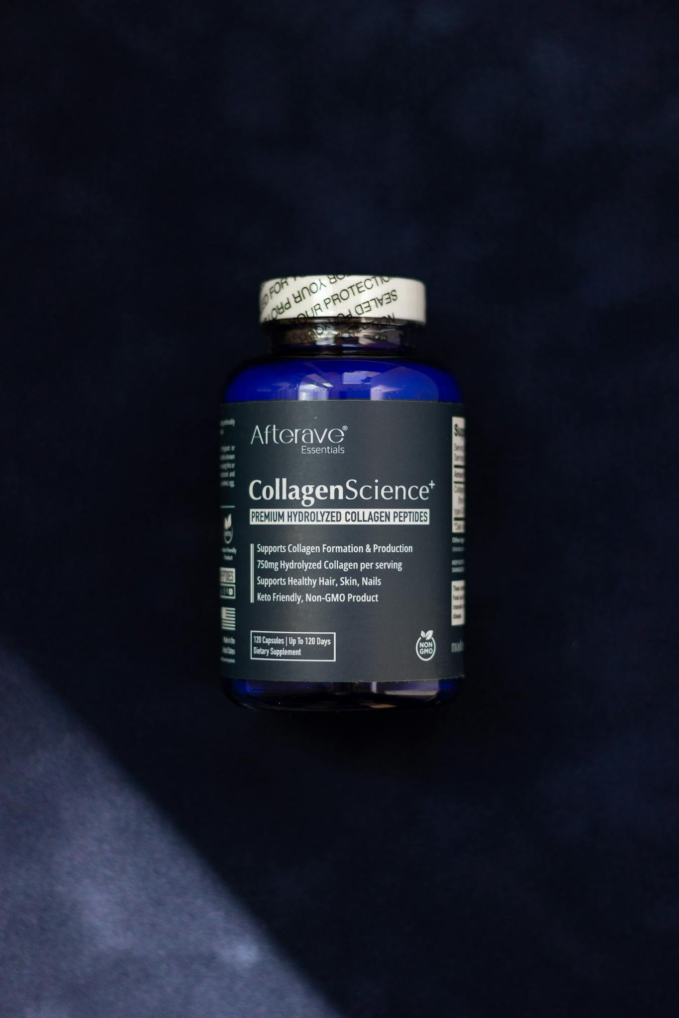 A CollagenScience supplement bottle promotes healthy skin on dark background.